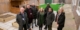 Group of seven people standing i newly refurbished children's centre garden in Greenwich